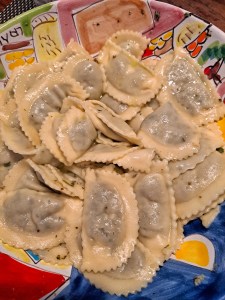 I am Sofia Lena Perissinotto, I am a blogger, content creator. In this blog post I write about Celle Ligure located in Liguria, Italy. This photo depicts a plate of fresh Pansoti, a type of filled pasta originating from the Genova area.