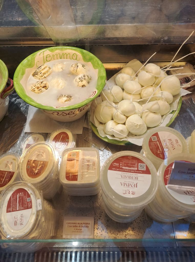 Hi, I'm Sofia Lena Perissinotto. I am a travel blogger. In this article I write about Cilento located in the Campania region of Italy. The photo is taken in Battipaglia, very close to the cilento area. It shows mozzarelle di Bufala Campana.