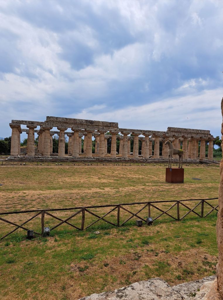 Hi, I'm Sofia Lena Perissinotto. I am a travel blogger. In this article I write about Cilento located in the Campania region of Italy. The photo shows Paestum's archeological site!