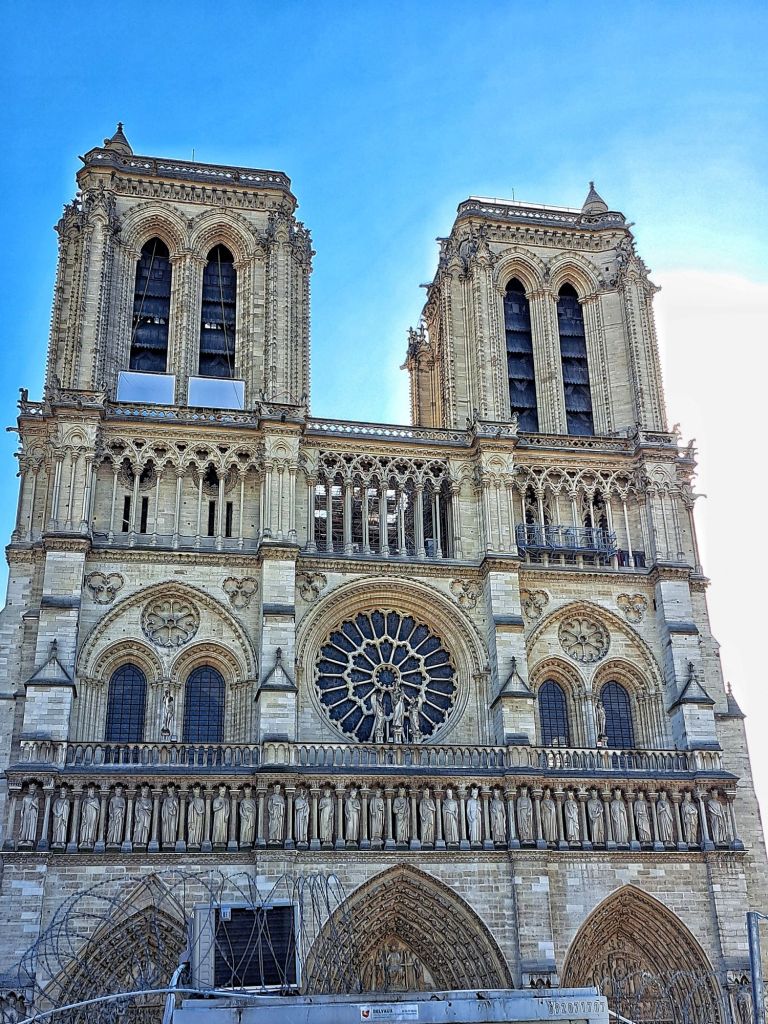 Hi, I'm Sofia Lena Perissinotto, I am a travel blogger. In this article I write about Paris, some iconic landmarks, why the city is special to me and also some café recommendations! This photo is taken at the Gothic Cathedral of Notre-Dame.