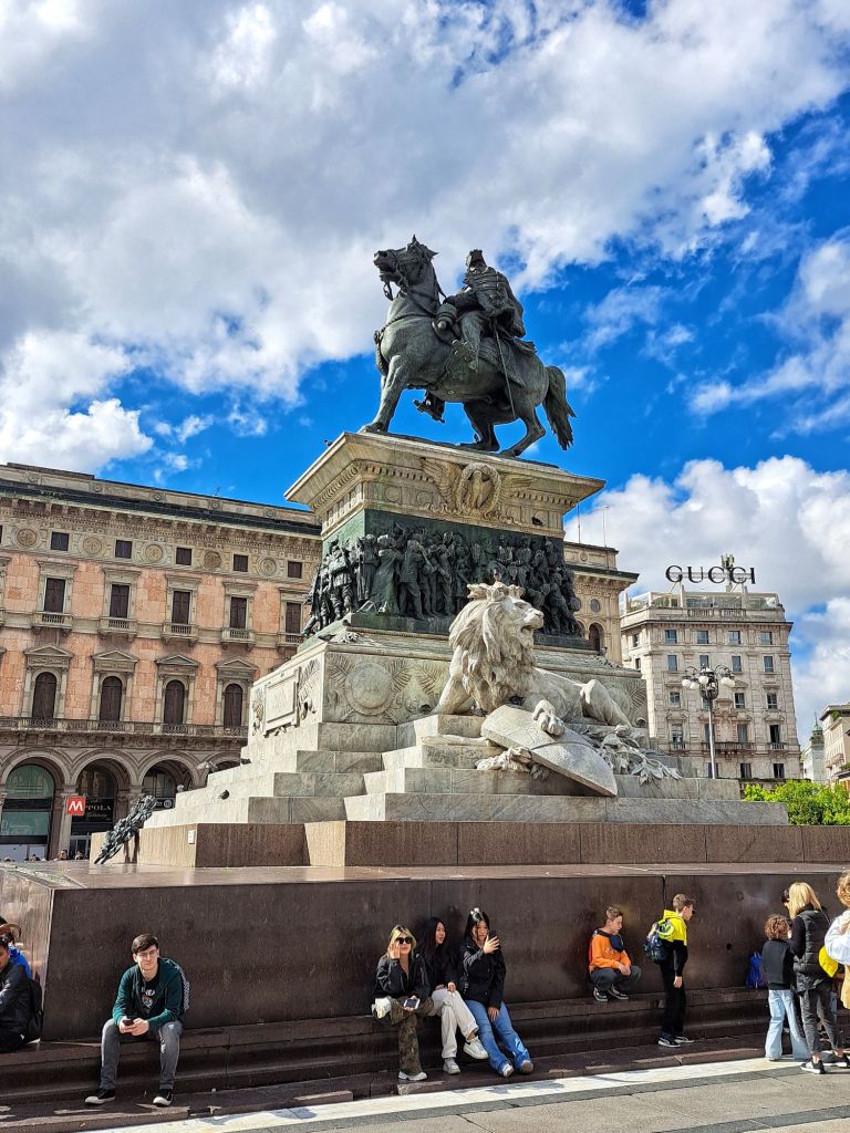 I am Sofia Lena Perissinotto, I am a blogger, content creator. In this travel article, I write about the magnificent Piazza Duomo in Milan! This photo features the Monument to Vittorio Emanuele II.