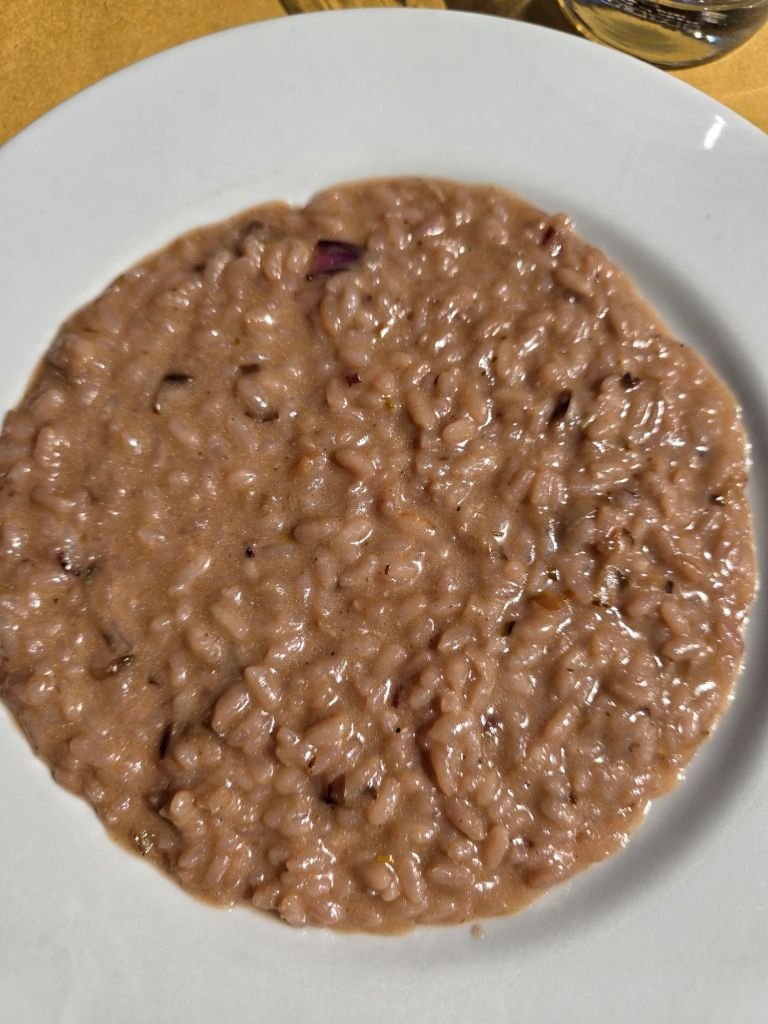 I'm Sofia Lena Perissinotto, and I'm a travel blogger. In this blog post I write about Piedmont, more specifically about Barolo, located in the stunning Alba area. This photo is taken at La Cantinella, a charming restaurant tucked away in via Roma.