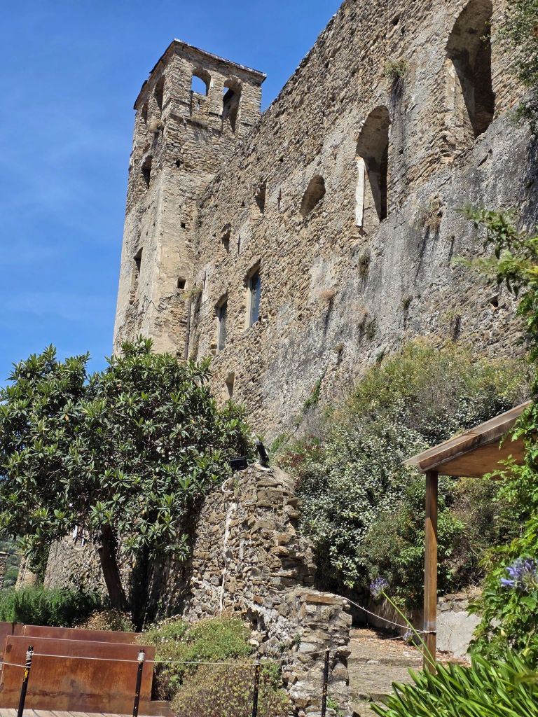 In this travel article I write about Dolceacqua, a picturesque, enchanting town located in the hinterland of Liguria. This photo shows the medieval Doria Castle.