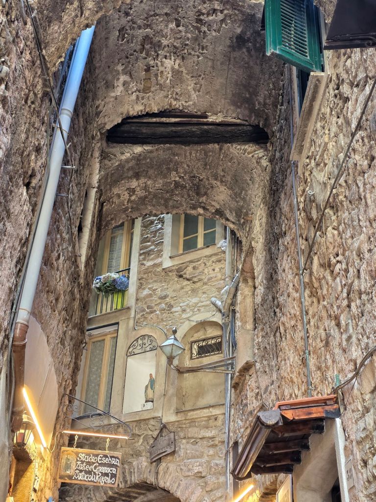 In this travel article I write about Dolceacqua, a picturesque, enchanting town located in the hinterland of Liguria.