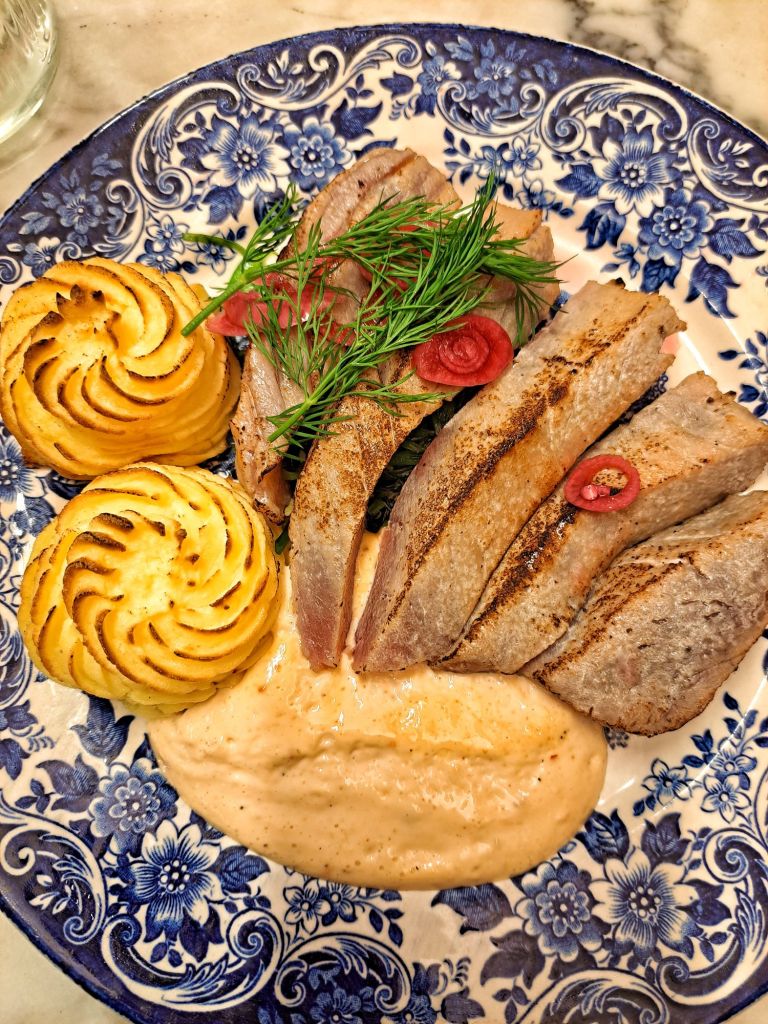 In this travel article, I write about Hötorget—the beating heart of Stockholm—highlighting local food markets, historic cafes, and more! This photo shows a gourmet dish at Hötorgshallen.